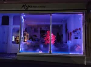 A hairdressers lit up purple