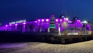 Clacton pier lit up purple