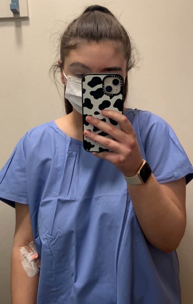 Female in hospital gown and facemask