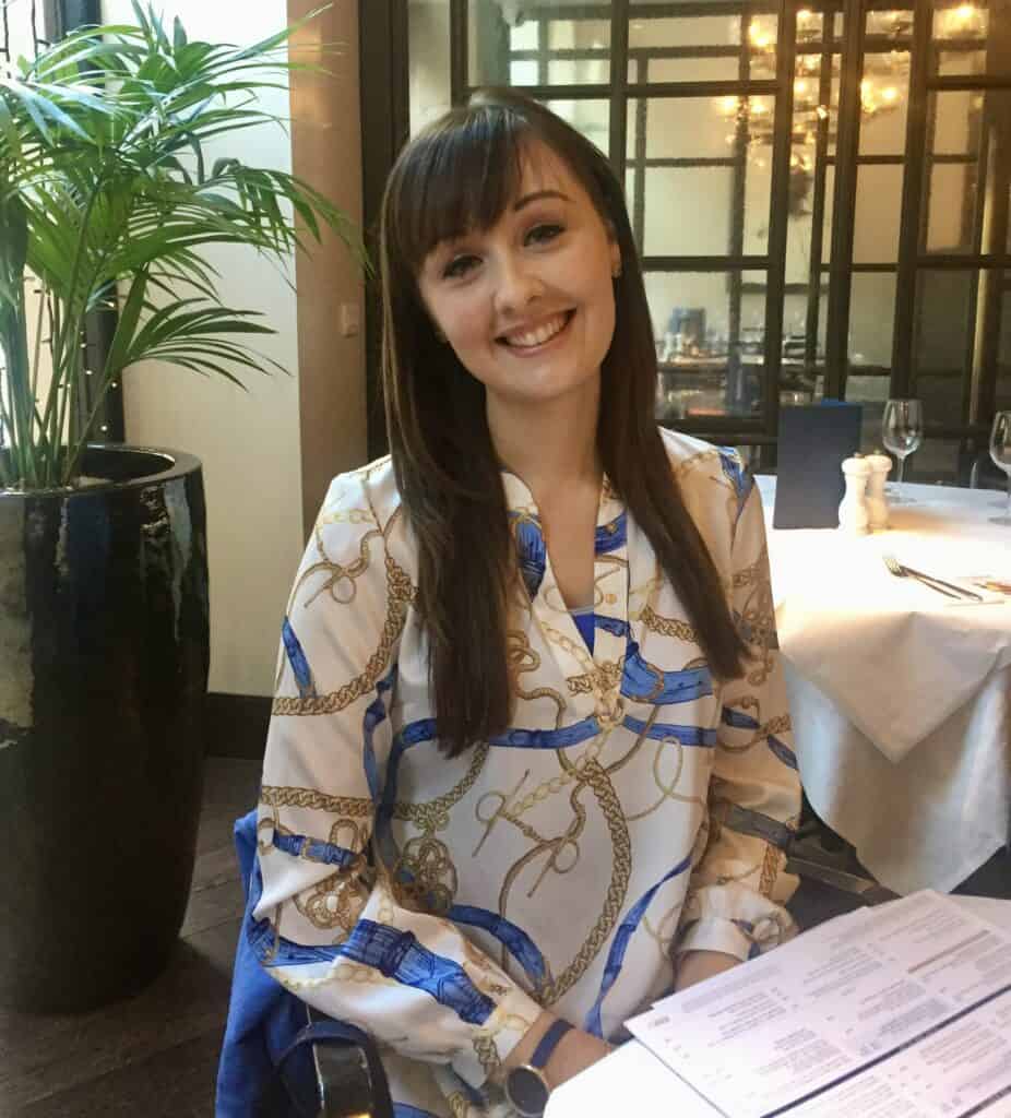Female sitting at a restaurant table