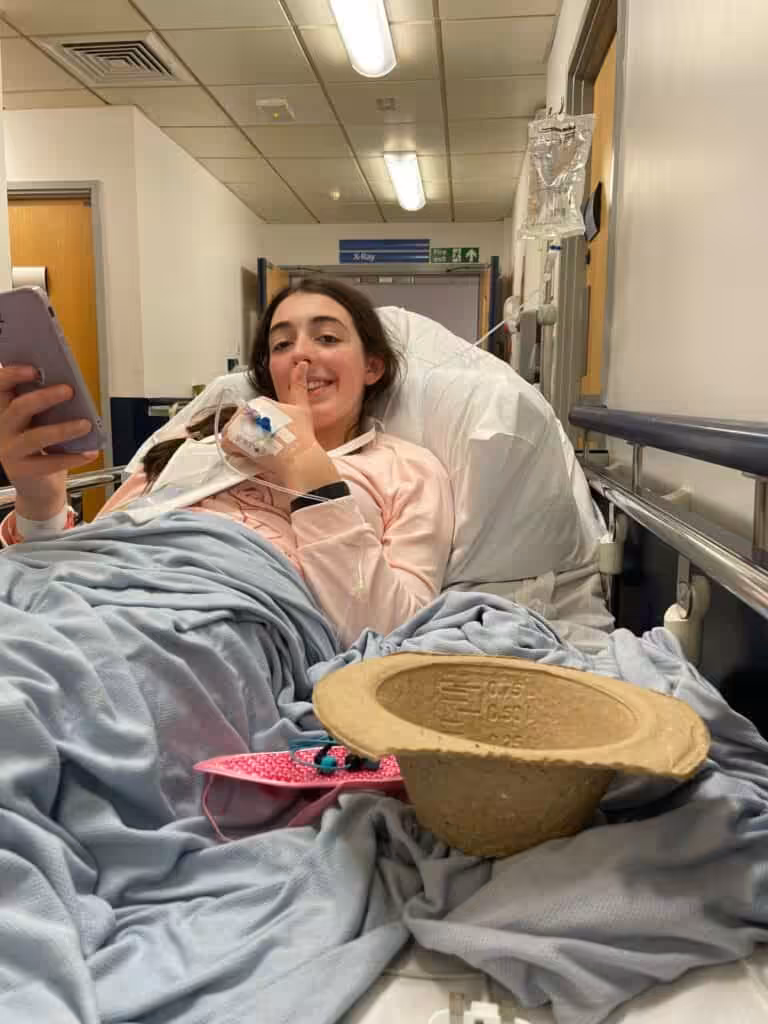 Photo of Sophia in a hospital bed.