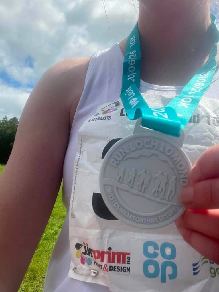 Rachel holding medal